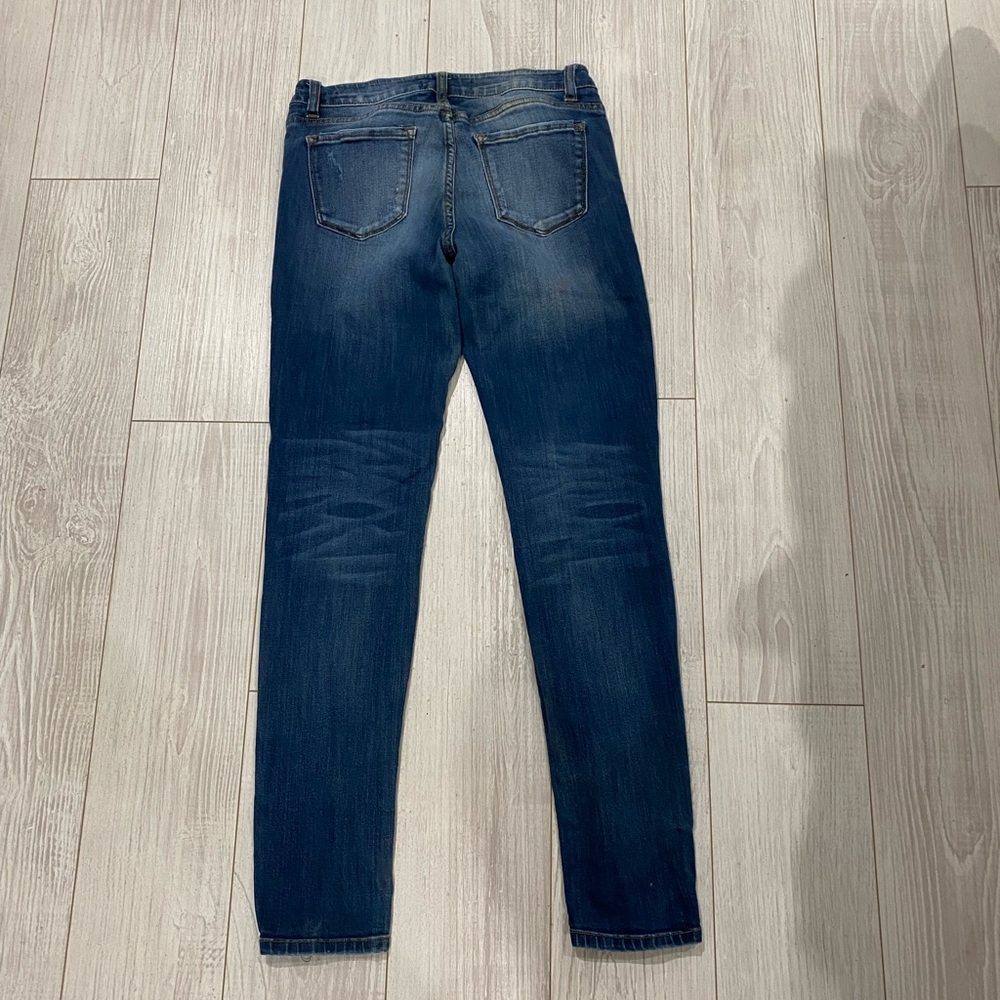 Multiple button dark wash skinny jeans